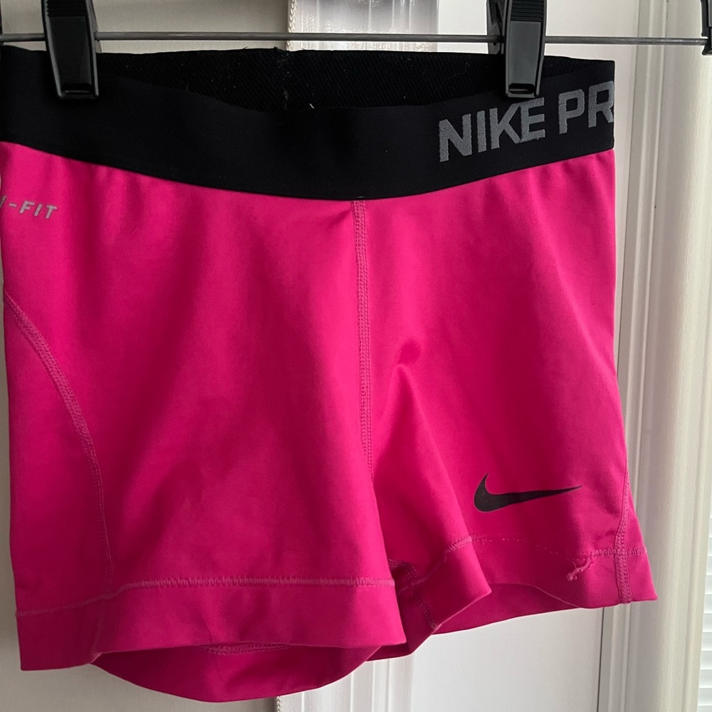 Bright pink Nike pro shorts